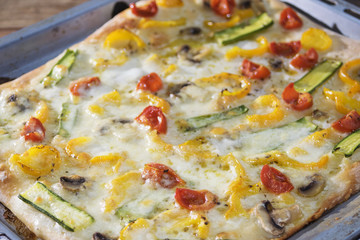 vegetarian pizza with tomatoes and zucchini
