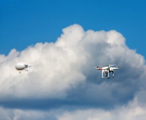 Naklejka na ściany i meble Flying drone in the sky