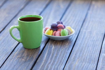 Cup of coffee and macarons