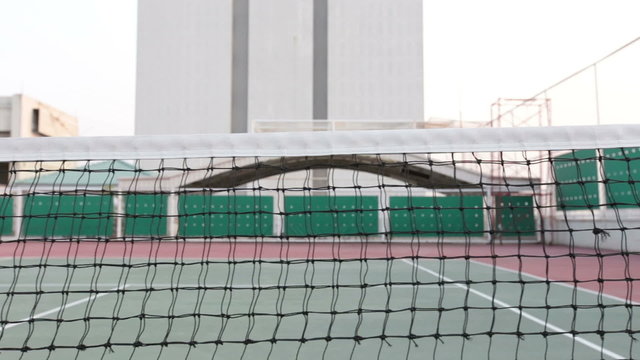 Tennis court with net tracking left