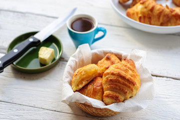 Breakfast with fresh baked croissants, butter and coffee