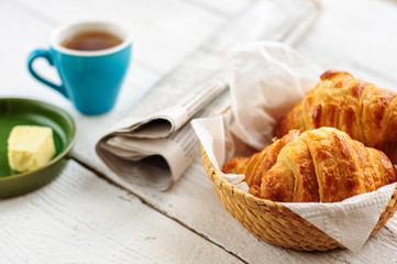Breakfast with fresh baked croissants, butter and coffee
