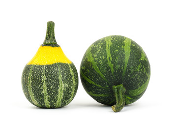 Raw pumpkins on white background