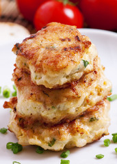 Homemade chicken cutlets sprinkled with green onion, selective f