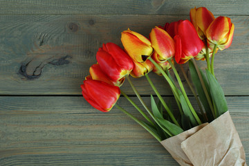 Fresh beautiful tulips on a wooden background