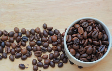 Roasted brown coffee beans,on wood background