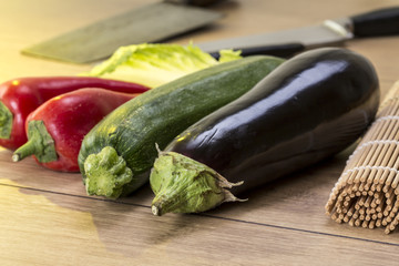 still life with eggplant, zucchini and red bellpepper