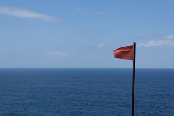 Ocean panorama view with red flag warning