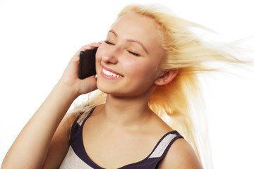 Obraz premium Pretty young woman using mobile phone