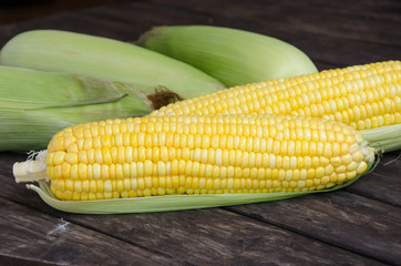 Sweet corn with wood table background