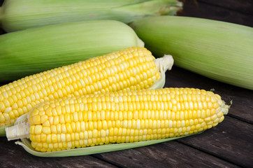 Sweet corn with wood table background