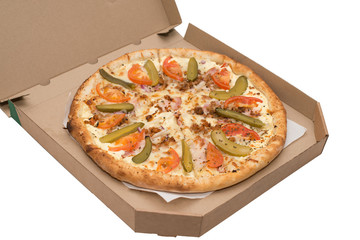 Pizza with vegetables and ham in a box