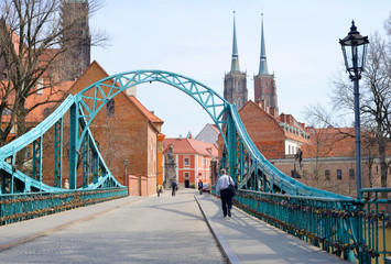 Obraz premium Wroclaw, Poland, bridge of Lovers with the Towers of the cathedral in the background