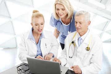 Doctors and nurse analyzing the result of medical tests.