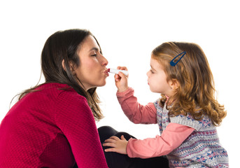 Mother and daughter playing with makeup