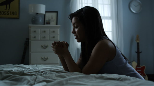 young woman praying