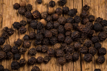 black pepper on wooden table