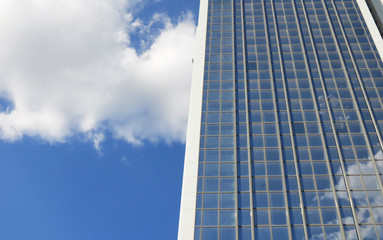 Obraz na płótnie Canvas window reflection dayligh as blue sky with clouds background