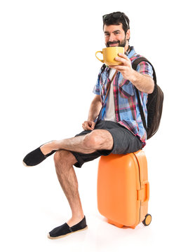 Tourist holding a cup of coffee