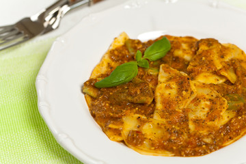 Spinach stuffed ravioli with tomato sauce and parmesan cheese