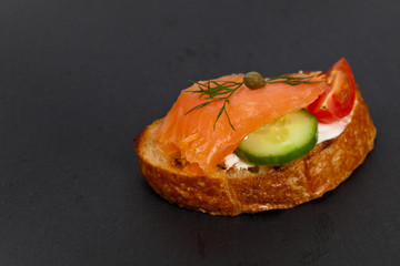Canape with smoked salmon. Selective focus.