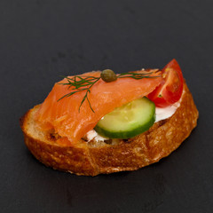 Canape with smoked salmon. Selective focus.