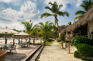 Fototapeta na wymiar Outdoor restaurant at the beach. Cafe on the beach, ocean and