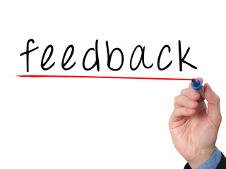 feedback concept with businessman hand writing.