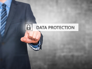 Businessman pressing Data Protection button on virtual screen