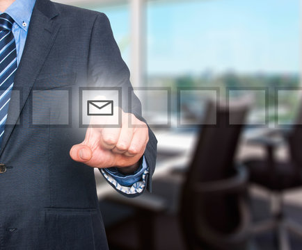 Business man Hand pressing virtual mail button