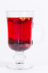 Red flowers fruit tea isolated in the transparent glass