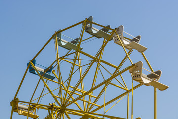Ferris Wheel Over Blue Sky
