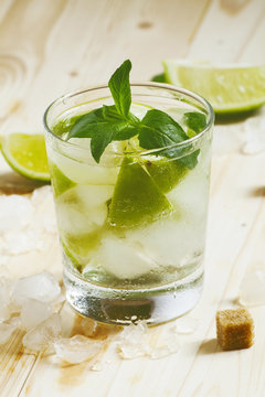 Fresh cocktail witn soda, lemon and mint, selective focus