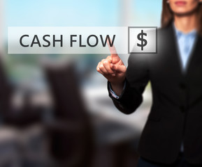 Businesswoman pressing Cash Flow button on virtual screen