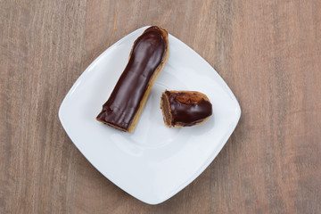 Tasty french chocolate Eclair cut in half