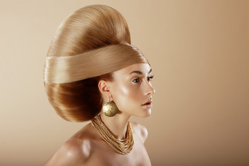 Styling. Profile of Glamorous Woman with Golden Hairdo