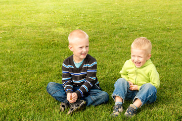 Happy children on green grass