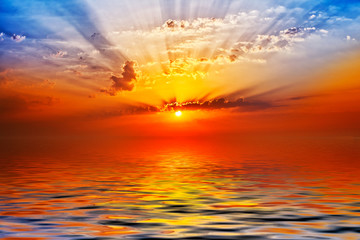 Panele Szklane Podświetlane  wschód słońca w morzu