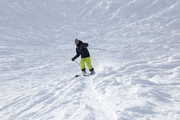 Athlete skiing in the snowy mountains