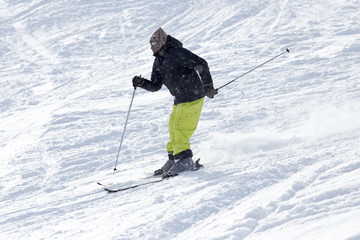 Fototapeta na wymiar Athlete skiing in the snowy mountains