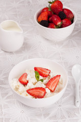 cottage cheese with berries, fresh berries and milk for breakfas