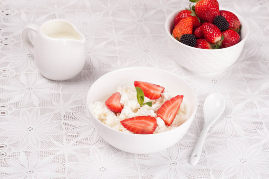 cottage cheese with berries, fresh berries and milk for breakfas