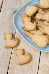 Blue plate with tasty cookies in the form of figurines 
