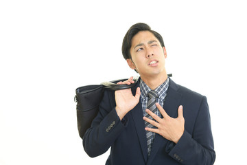 痛みを訴えるビジネスマン
