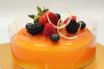 Orange jelly cake and mixed  berry