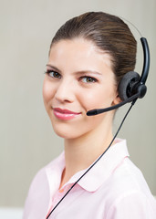 Female Call Center Employee With Headphones