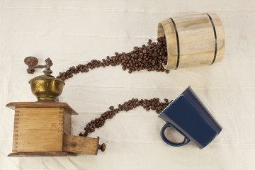 spilled coffee beans, coffee mug, old coffee grinder