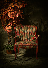 Antique Empty Chair with Colorful Pattern and Plant.