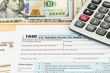 Tax form with banknote, and calculator