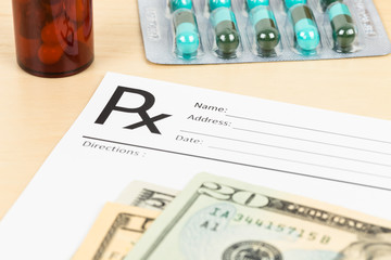 Fototapeta premium Blank prescription, banknote, and medicine